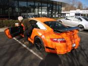 English: Ralph Lauren getting in his orange Porsche 997 GT3 RS after talking with us for a while.