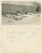 Bodies of 3 men lying as they fell after being executed.