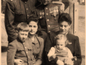 Vladimir (bottom left) with 'aunt Zhenya' (next), father Semyon Vysotsky (standing, to the right) with brother Alexey, his wife and child.