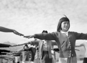 Camp life at Manzanar: Female internees practicing calisthenics, 1943.