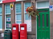 English: Double vision? There is no obvious reason why the Post Office in Dunkeld Street, Aberfeldy needs identical twin post boxes. At least there is a third box alongside for junk mail.