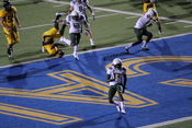 Oregon punt returner Cliff Harris scores a touchdown on a punt return during an away game against the California Golden Bears in Berkeley. The Ducks won 15-13.