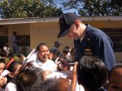 English: Cebu City, Philippines (Feb. 13, 2007) - Ensign William Gibson signs autographs for students from Cebu's Lo-ok Elementary School during a community service project. Amphibious command ship USS Blue Ridge (LCC 19) and embarked 7th Fleet staff are 