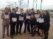 English: Members of the Benet Academy Law Club hold their award certificates after participating in a mock trial at the DuPage County Courthouse in Wheaton, Illinois.