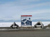The traditional welcome sign at Barrow, Alaska. Notice the two whale jawbones. The body of the sign is written in Inupiat (Eskimo).