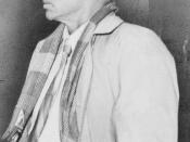 E.E. Cummings, full-length portrait, facing left, wearing hat and coat / World-Telegram photo by Walter Albertin.