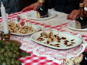 English: Balsamic vinegar drizzled over chunks of parmesan cheese, Modena, Italy.