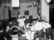 English: Globe and Mail newspaper staff wait for news of the D-Day invasion. Toronto, Canada.