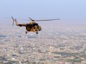 Mazar-e Sharif, Afghanistan (November 13, 2010) - An Afghan National Army Mi-17 helicopter flies over the northern Afghan city of Mazar-e Sharif following a supply mission to an outpost at Qush Tappeh, Afghanistan. (Photo by MC1 Eric S. Dehm, US Navy)