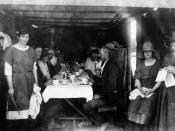 English: Customers at the refreshment room after the fires in Chinchilla in 1922 An emergency shelter set up with tables, chairs, tablecloths and crockery to serve meals during the relief efforts after the fire. Women are wearing hats and a young woman to