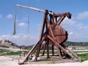 A trebuchet uses the gravitational potential energy of the counterweight to throw projectiles over long distances.
