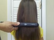 English: Example:hair being straighten with a regular curly iron.