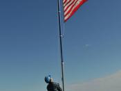 English: ATLANTIC OCEAN (May 8, 2011) Seaman Arthur Miller, assigned to the guided-missile frigate USS Thach (FFG 43), raises the union jack on the foc'sle as Thach anchors off the coast of Rio Grande, Brazil, while participating in the Atlantic phase of 