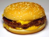 Photo of a McDonald's Quarter Pounder (Royale) with Cheese.