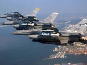 A three-ship formation of Air National Guard F-16 Fighting Falcons flies over Kunsan City, South Korea. The F-16s are from New Mexico, Colorado and Montana.