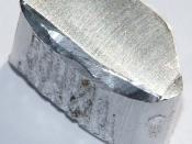 English: Chunk of aluminium, 2.6 grams, 1 x 2 cm.